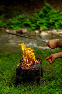 Person holding bonfire