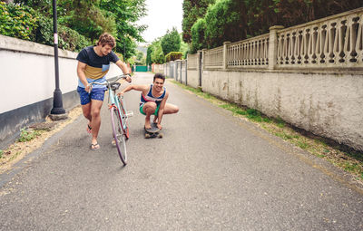 Male friends on road