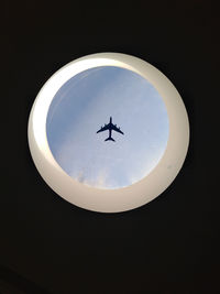 Low angle view of airplane in sky