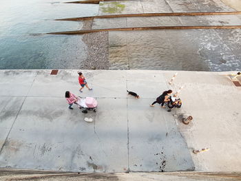 High angle view of people enjoying in water