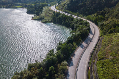 High angle view of dam amidst trees