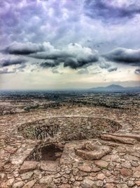 Aerial view of landscape against cloudy sky