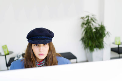Woman sitting by the desktop at the office