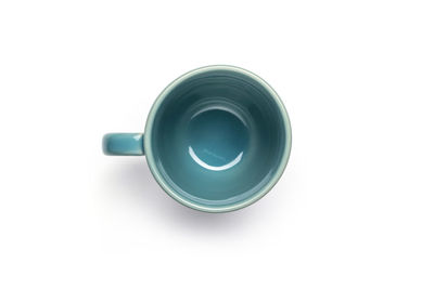 High angle view of tea cup against white background