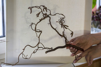 Close-up of hand holding paper
