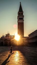 Silhouette of people at sunset