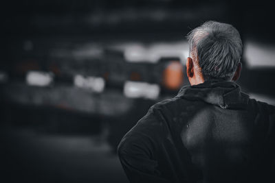 Rear view of man standing outdoors