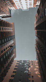 Low angle view of buildings in city against sky