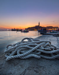 Close-up of rope on pier during sunset