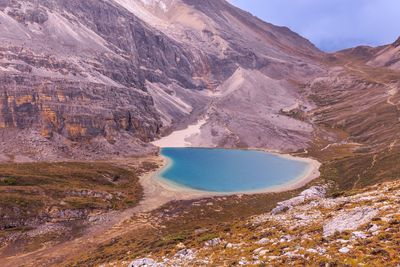 Scenic view of lake and mountains against sky