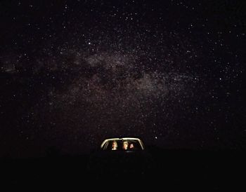 Close-up of car against sky at night