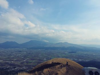 Scenic view of landscape and mountains against sky