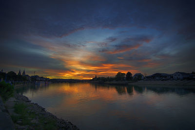 Scenic view of lake against sky during sunset