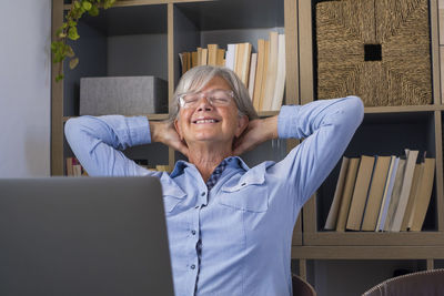 Smiling senior woman relaxing at home