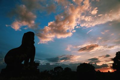 Low angle view of statue against sky during sunset