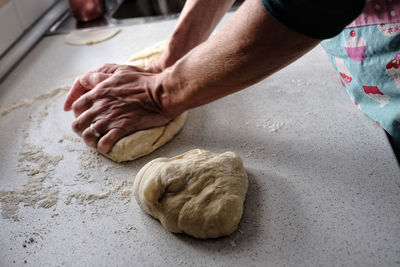 Midsection of man preparing food