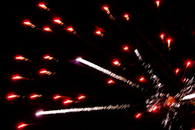 Low angle view of illuminated christmas lights at night