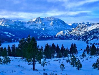 Scenic view of snow covered mountains against sky