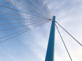 Low angle view of bridge against blue sky