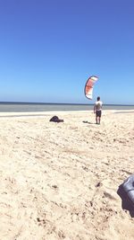 View of person on beach against sky