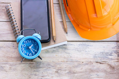 High angle view of clock on table