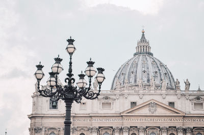 Low angle view of building against cloudy sky