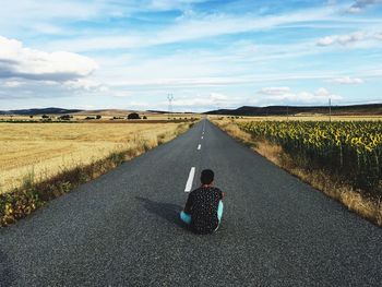 View of road passing through field