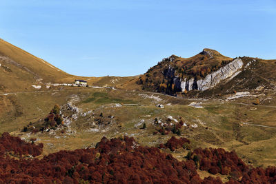 Sudtirol malga hiking trail in autumn foliage, trentino, italy, trento