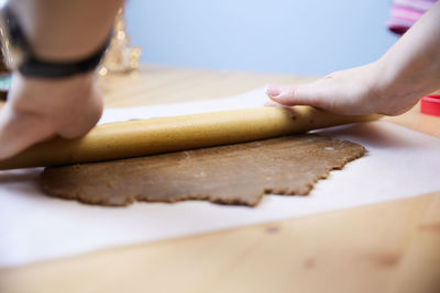 Low section of woman sitting on table