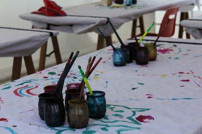 Close-up of paintbrushes on table