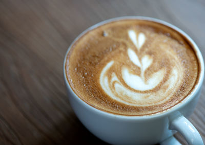High angle view of cappuccino on table