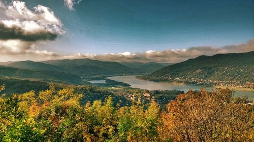 Scenic view of mountains against cloudy sky