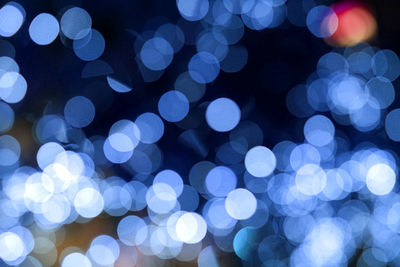 Defocused image of illuminated blue lights