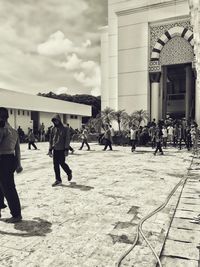 People at town square against sky