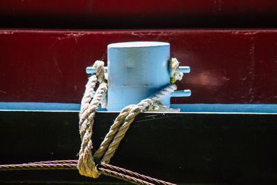 Close-up of rope tied to bollard