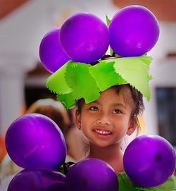 Cute girl with purple balloons