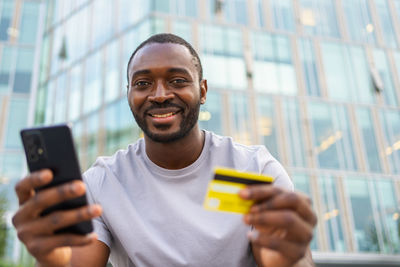 Young man using mobile phone