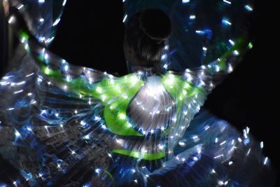 Blurred motion of man at illuminated nightclub