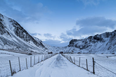 Scenic view of snow covered mountains against sky