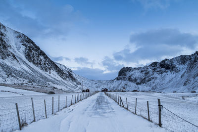 Scenic view of snow covered mountains against sky