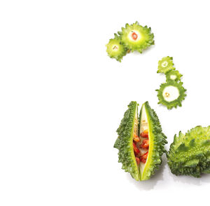 Close-up of fruits against white background