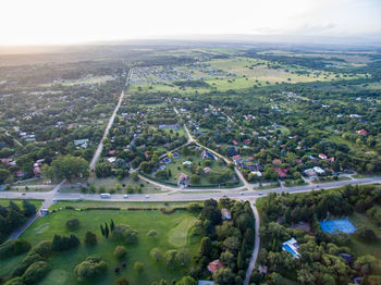 High angle view of trees and buildings against sky