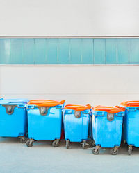 View of chairs against blue wall