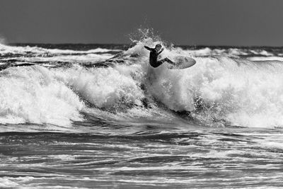 Man surfing in sea