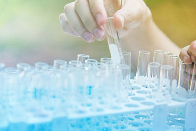 Cropped hand of scientist holding test tube