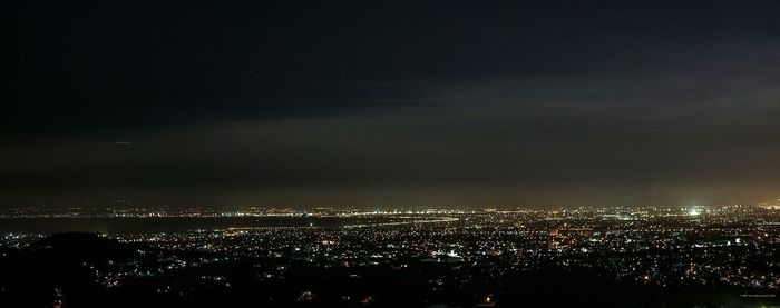 Illuminated cityscape at night