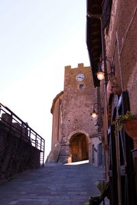 Low angle view of old historic building against clear sky