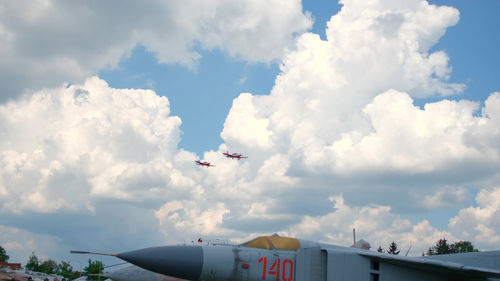 Low angle view of airplane flying in sky