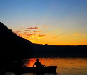 Scenic view of lake at sunset