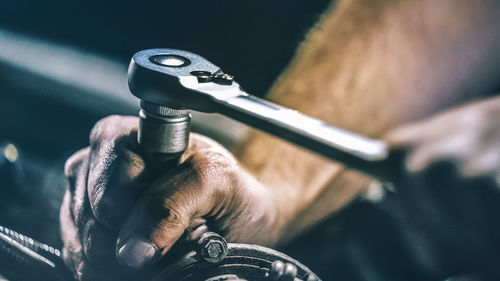 Close-up of hand holding machine